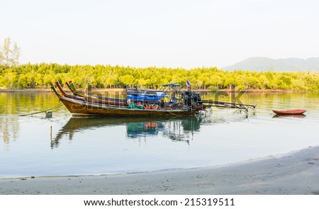 LONG TAIL BOAT TOUR PARKED IN PAK MENG PIER,TRANG PROVINCE,THAILAND