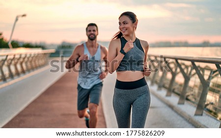 Similar – Image, Stock Photo Young man doing exercises outside on grass during his calisthenics workout