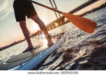 Similar – Image, Stock Photo Crop surfer on board in sea water