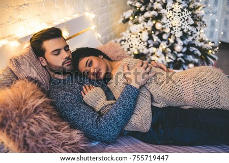 https://image.shutterstock.com/display_pic_with_logo/177219002/755719447/stock-photo-passionate-romantic-couple-spending-time-before-new-year-near-beautiful-christmas-tree-at-home-755719447.jpg