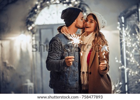 Similar – Image, Stock Photo Young couple enjoying Christmas Lights
