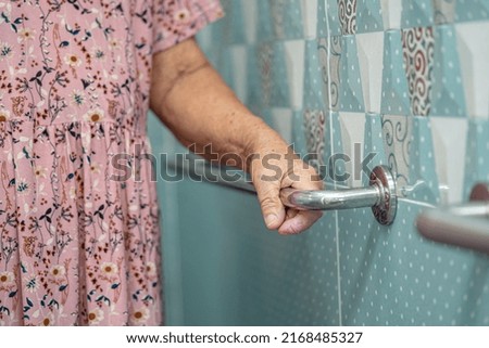 Similar – Image, Stock Photo Man grabs the toilet paper on the toilet