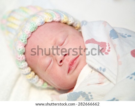 Napping infant bundled up warm