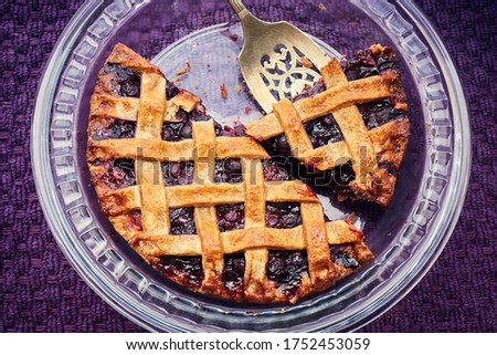 Similar – Image, Stock Photo Sliced blueberry pie. Lattice crust cake top view