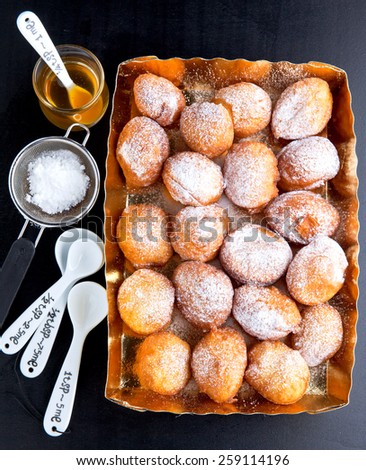 donuts in a glass vase, powdered sugar and honey