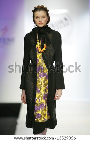 Model presents a creation from the collection by Russian designer Sharoeva during the Russian Fashion Week in Moscow.