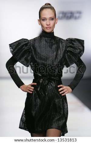 Model presents a creation from the  collection by Russian designer Teplov during the Russian Fashion Week in Moscow.