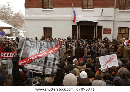 MOSCOW - DECEMBER 27: Supporters of the former  Yukos oil company chief executive officer Mikhail Khodorkovsky hold his portraits and posters outside the court December 27, 2010 in Moscow, Russia.