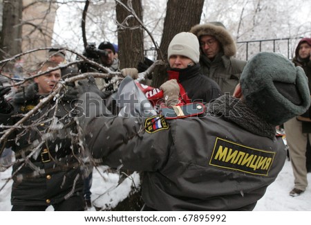 MOSCOW - DECEMBER 27: Russian police detain a supporter of Yukos oil company chief executive officer Mikhail Khodorkovsky during a rally outside the court December 27, 2010 in Moscow, Russia.