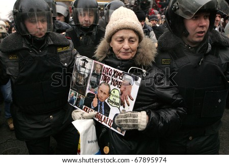 MOSCOW - DECEMBER 27: Russian police detain a supporter of Yukos oil company chief executive officer Mikhail Khodorkovsky during a rally outside the court December 27, 2010 in Moscow, Russia.