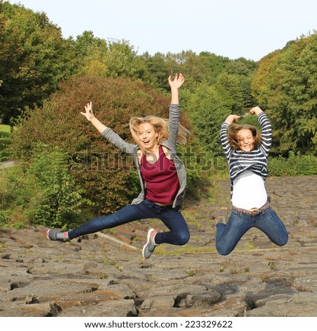 Teenagers jumping at park