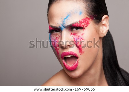 screaming emotional girl with painted face