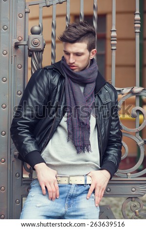 Fashionable man posing in old city