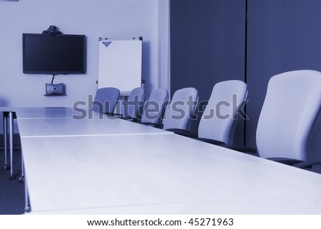 Conference room with video conference equipment and laptop
