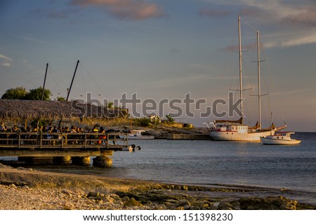 Beach restaurant with sail boat in sunset, Boca Sami, Curacao, Netherlands Antilles