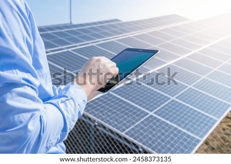 Similar – Foto Bild Unerkennbarer Ingenieur am Solarpanel