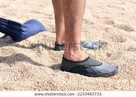 Image, Stock Photo Person wearing neopren socks on a dive boat