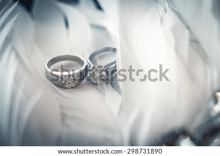 wedding ring on plumage