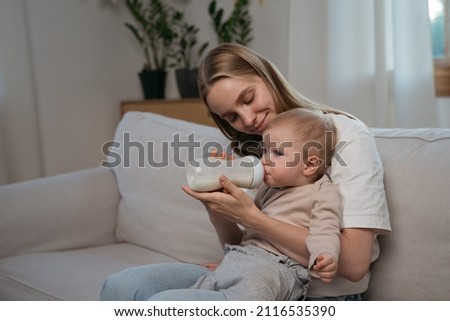 Similar – Image, Stock Photo Toddler drinking milk bottle
