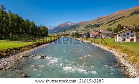 The village of S-Chanf, located in the Upper Engadine Valley (Grisons, Switzerland), as seen from the stone Inn Bridge (Inn Brücke) over the river Inn. It's located near the gorgeous Swiss National Pa Foto stock © 
