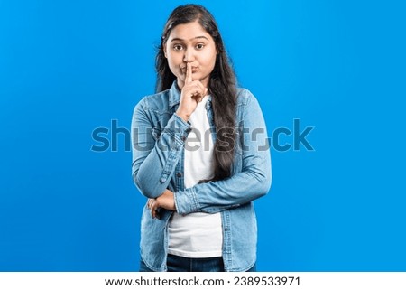 Similar – Image, Stock Photo Ethnic woman showing silence gesture in field