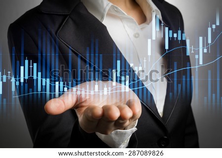 business woman in black suit with bear hand for support stock financial graph.