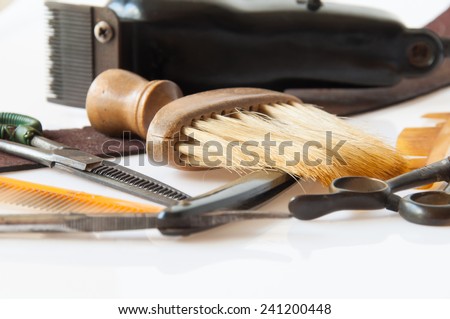 Scissors, barber\'s brush and comb is basic equipment of hair