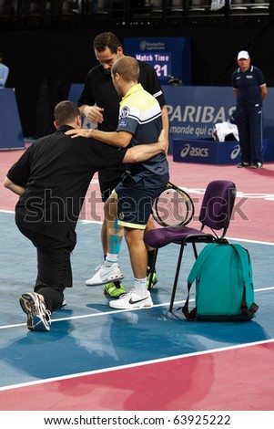 MONTPELLIER - FRANCE - OCTOBER 26 : Olivier Rochus constrained to give up his match against Michael Llodra because of an injury during the Montpellier Tennis Open Sud de France. On October 26, 2010 in Montpellier, France