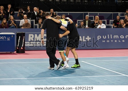 MONTPELLIER - FRANCE - OCTOBER 26 : Olivier Rochus constrained to give up his match against Michael Llodra because of an injury during the Montpellier Tennis Open Sud de France. On October 26, 2010 in Montpellier, France
