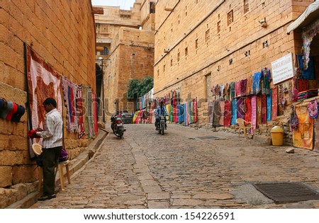 JAISALMER, RAJASTHAN, INDIA - OCT. 16: Shopping street in the fort of Jaisalmer OCT. 16, 2012 in Jaisalmer, Rajasthan, India. Early morning in the eastern city.