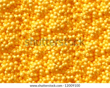 yellow plastic grains texture background