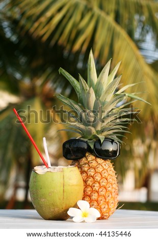 fresh coconut drink and pineapple on the table