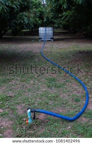 Water Valve P.V.C. in garden,on white plastic chemical tanks background Stock fotó © 