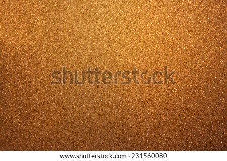 Abstract golden dust or sand background with blur edges of image