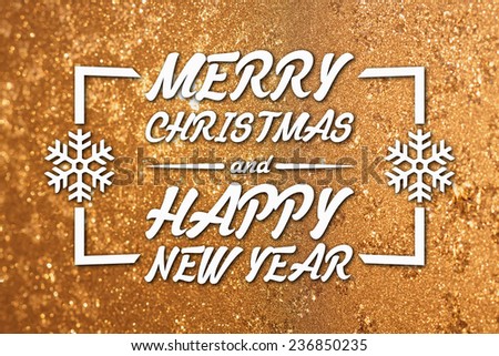 Merry Christmas and New Year greeting card on blurred frozen winter yellow or gold colored background