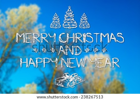 Merry Christmas and New Year hand drawing greeting card on blurred trees with frost blue sky background