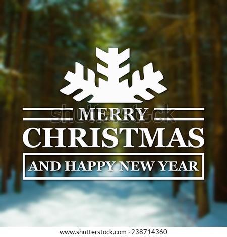 Merry Christmas and New Year greeting card on blurred green spruces or fir-trees in winter forest background
