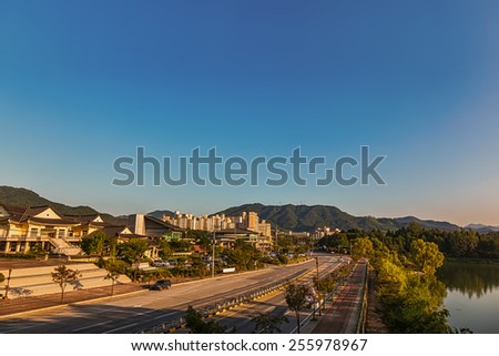 Chungju city cityscape in South Korea with old traditional and modern building architecture, central road, mountain and lake