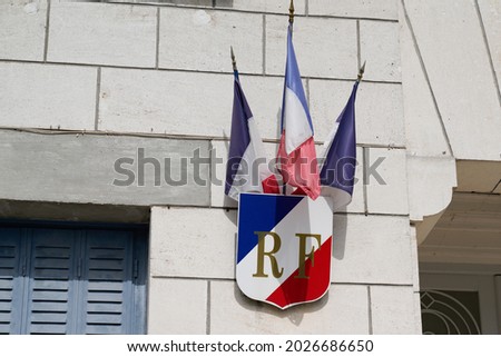rf text french means france republic on city hall with france flag on outdoor facade building wall in town Stock fotó © 