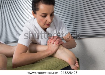 Chinese massage on man\'s feet