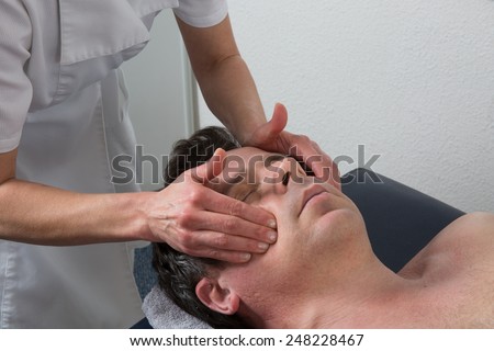 A man having a chinese massage on table massage