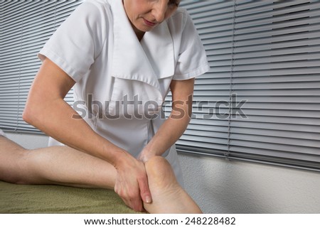 Chinese massage on man's feet