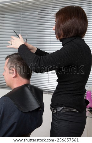 Close up shot of man getting his hair cut