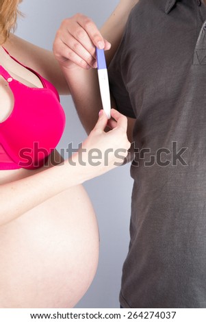 Pregnancy test - happy surprised woman, positive result