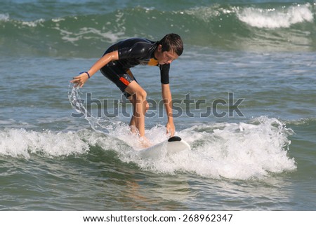 Boy learning how to surf