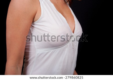 A woman in a white transparent top without bra