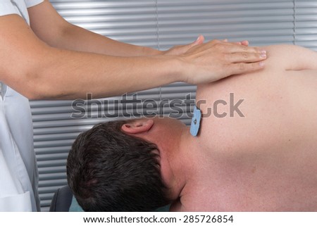 doing massage of electrostimulator Medical procedure.