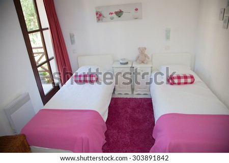 Two single bed in a beautiful room of the house