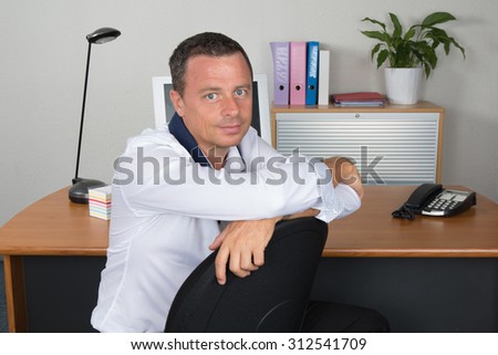 Middle age businessman working on laptop computer