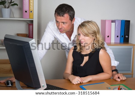 Man and woman working together on a project